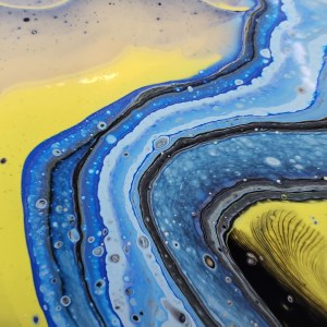 Abstract painting with flowing blue, yellow, and black swirls.